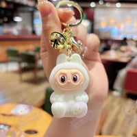 Découvrir le modèle WHITE / 5.5cm Porte-clé Mini Labubu - modèle WHITE / 5.5cm - MaPelucheLabubu.fr | Adoptez votre Labubu : Peluches et Figurines Uniques