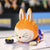 Figurine Labubu discipline Sportive VolleyBall - modèle curling - MaPelucheLabubu.fr | Adoptez votre Labubu : Peluches et Figurines Uniques
